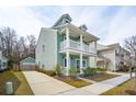 Stylish two-story home showcasing a spacious driveway and welcoming curb appeal at 1651 Valley Oak Rd, Johns Island, SC 29455