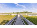 Marsh front home featuring a dock for easy water access and beautiful views at 178 Beresford Creek St, Daniel Island, SC 29492