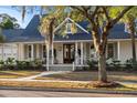 Charming two-story home with a welcoming front porch and well-manicured lawn at 178 Beresford Creek St, Daniel Island, SC 29492