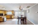 Dining area adjacent to kitchen features tile flooring and three sunny windows at 1925 Old Parsonage Rd, Charleston, SC 29414