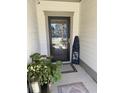 Entryway featuring a black front door, decorative mat, and a vibrant plant to greet guests at 2009 Utsey St, Johns Island, SC 29455