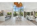 A spacious living room features high ceilings, large windows, and an open floor plan at 204 E Huron Ave, Folly Beach, SC 29439