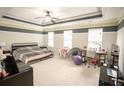 Spacious main bedroom features neutral carpet, ceiling fan, and plenty of space at 2049 Maybelles Ln, Charleston, SC 29414