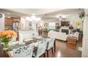 Bright, open-concept living area with hardwood floors, modern lighting, and view to living room and kitchen at 2049 Maybelles Ln, Charleston, SC 29414