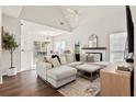 Bright living room with vaulted ceilings, a fireplace, and an open layout, featuring hardwood floors at 2050 S Smokerise Way, Mount Pleasant, SC 29466