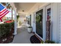Inviting front porch with rocking chairs and decorative potted plants at 2052 Bancroft Ln, Mount Pleasant, SC 29466