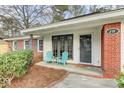 Cozy front porch featuring seating, a welcome mat, and charming architectural details, perfect for relaxing outdoors at 211 Logan Dr, Summerville, SC 29483
