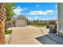 Detached garage with a paved driveway and manicured landscaping, blending functionality with style at 2842 Rutherford Way, Charleston, SC 29414