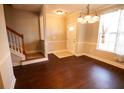 Inviting dining area with hardwood floors and a decorative chandelier near the staircase at 2926 Sugarberry Lane Ln, Johns Island, SC 29455