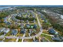 Stunning aerial view of a residential neighborhood with lush landscaping, private pools, and marsh views at 2961 Yachtsman Dr, Mount Pleasant, SC 29466