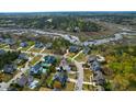 Picturesque aerial view of homes nestled in a wooded community, showcasing waterways and serene surroundings at 2961 Yachtsman Dr, Mount Pleasant, SC 29466