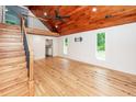 Spacious living room with high wood ceiling, wood floor, and staircase at 3166 Edenvale Rd, Johns Island, SC 29455