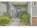 Welcoming front porch with decorative accents and well-maintained landscaping, creating a charming entrance at 343 Iveson Rd, Summerville, SC 29486