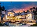 Stunning backyard with a sparkling pool, lounge chairs, and outdoor seating under a covered patio at 3894 Sawyers Island Dr, Mount Pleasant, SC 29466