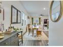Bright dining area featuring a wooden table, bench seating, and modern decor at 429 Pender Woods Dr, Summerville, SC 29486