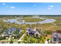 Waterfront home with marsh views, private boat dock, and lush greenery at 430 Fish Tale Rd, Charleston, SC 29492