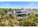Beautiful brick home featuring a swimming pool, with surrounding landscaping and backyard at 430 Fish Tale Rd, Charleston, SC 29492