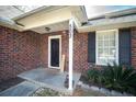 Welcoming front porch with brick facade and decorative accents at home entrance at 503 Amberjack Way, Summerville, SC 29485