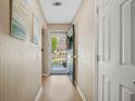 Inviting hallway with neutral walls and view of the front door to home at 503 Amberjack Way, Summerville, SC 29485