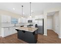 Bright kitchen with granite countertops, stainless steel appliances, and a kitchen island at 509 Purple Finch Rd, Summerville, SC 29486