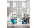 Bright and airy living room featuring a neutral color palette, tall windows, and comfortable seating at 523 Verdi Dr, Summerville, SC 29486