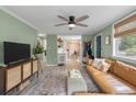 Open living room featuring a connecting view to the kitchen and dining area, great for entertaining at 7 Briarcliff Dr, Charleston, SC 29407