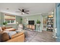 Stylish living room with modern decor, featuring a comfortable seating area and a ceiling fan at 7 Briarcliff Dr, Charleston, SC 29407