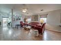 Open-concept living area featuring hardwood floors, neutral walls and ample natural light and stylish furniture at 8095 Old London Rd, North Charleston, SC 29406