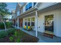 Inviting front porch featuring a comfortable bench and a charming 