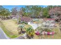 Aerial view showcasing the home, detached garage, private pool area, and lush landscaping at 117 Hartin Blvd, Summerville, SC 29486