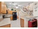 Open kitchen featuring wood cabinetry, tiled floors, breakfast bar and modern appliances providing a functional cooking space at 123 Thousand Oaks Ct, Summerville, SC 29485