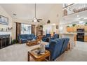 Spacious living room with vaulted ceilings, a fireplace, and lots of natural light perfect for relaxation and entertaining at 123 Thousand Oaks Ct, Summerville, SC 29485