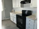 Well-equipped kitchen with modern range and white cabinets for ample storage space at 139 Stephanie Cir, Summerville, SC 29483