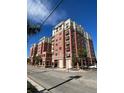 A brick building with many stories and balconies sits under a bright blue sky at 150 Bee St # 713, Charleston, SC 29401