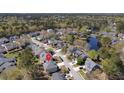 Aerial view showcasing the property's location within a serene neighborhood with mature trees and a pond at 1704 Tolbert Way, Mount Pleasant, SC 29466