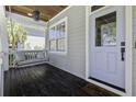 Inviting front porch featuring a swing, perfect for relaxing and enjoying the outdoors at 1704 Tolbert Way, Mount Pleasant, SC 29466