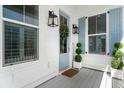 Charming front porch details include a blue front door with a festive wreath and elegant lanterns at 1772 Agate Bay Dr, Mount Pleasant, SC 29466