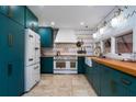 Updated kitchen with custom cabinetry, farmhouse sink, and a chef's range and refrigerator at 2014 Ion Ave, Sullivans Island, SC 29482