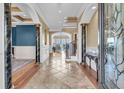 Spacious foyer with elegant tile flooring, decorative columns, and views into the living areas at 2292 Beckenham Dr, Mount Pleasant, SC 29466