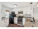Contemporary kitchen equipped with granite countertops, stainless steel appliances, and white cabinets at 270 Stefan Dr # 11-C, Charleston, SC 29412