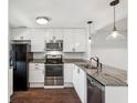 Stylish kitchen featuring stainless steel appliances, granite counters, and white cabinetry at 270 Stefan Dr # 11-C, Charleston, SC 29412