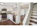 Modern kitchen with stainless steel appliances, granite countertops, and dark wood floors at 270 Stefan Dr # 11-C, Charleston, SC 29412