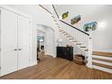 Inviting foyer features a staircase, hardwood floors, and elegant decor at 2912 Yachtsman Dr, Mount Pleasant, SC 29466