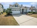 Charming home featuring a two-car garage, and cozy front porch at 415 Four Seasons Blvd, Summerville, SC 29486