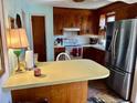 Efficient kitchen with stainless steel refrigerator and breakfast bar at 4228 Oakridge Dr, North Charleston, SC 29418