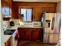Well-lit kitchen with stainless steel appliances and ample counter space at 4228 Oakridge Dr, North Charleston, SC 29418