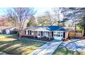 Aerial view of a charming brick home with a well-maintained yard and mature trees at 4437 Garwood Dr, Ladson, SC 29456