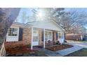 Welcoming front porch with rocking chairs, charming flowers, and great curb appeal at 4437 Garwood Dr, Ladson, SC 29456