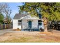 Inviting home featuring a quaint front porch and mature landscaping at 4625 Durant Ave, North Charleston, SC 29405