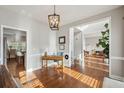 Bright room featuring hardwood floors and stylish desk area at 5556 Indigo Fields Blvd, North Charleston, SC 29418